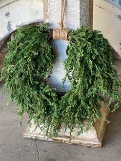 a wreath hanging on the side of a building