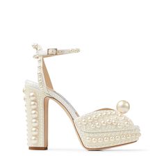 a women's high heeled shoe with pearls