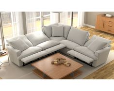 a living room with a sectional couch and coffee table