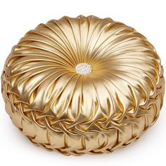 a gold decorative round pillow on a white background