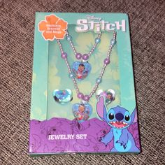 the disney stitch jewelry set is in its package