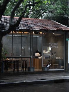 a coffee shop sitting on the side of a road