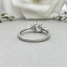 This beautiful ring is made from genuine 925 sterling silver with rhodium plating. Ring details- -The Main stone is an Oval Cut 8x6mm Simulated diamond -Side stones are 4mm by 2mm clear Marquise and 1.5mm Round simulated diamonds -Ring is casted in solid 925 sterling silver with rhodium plating (yellow gold and rose gold plated also available, please check the drop down menu for more options) -The Total face height of the ring measures 8mms and the band width measures 1.6mms -Each ring is handma Silver Open Diamond Ring For Promise, White Gold Crystal Marquise Cut Promise Ring, Diamond White Rings With Polished Finish, Diamond White Polished Finish Round Band Rings, Anniversary Marquise Cut Halo Ring, Diamond Promise Ring With Polished Finish, Polished Round Cut Diamond Promise Ring, Sterling Silver Diamond Ring With Polished Finish For Promise, Diamond White Cubic Zirconia Ring With Polished Finish