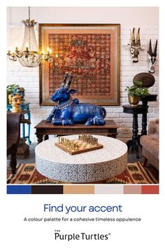 a living room filled with furniture next to a painting and chandelier above a coffee table