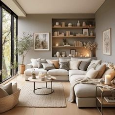 a living room filled with lots of furniture next to large windows on top of a hard wood floor