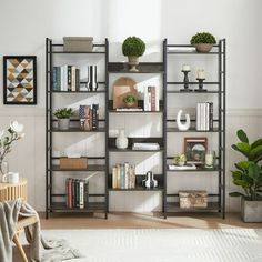 a living room filled with lots of furniture and bookshelves on top of each other