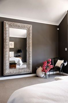 a room with a large mirror on the wall