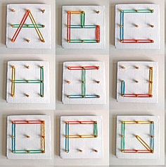 the letters are made out of colored pins