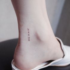 a person with a small tattoo on their foot that reads, i love my tattoos