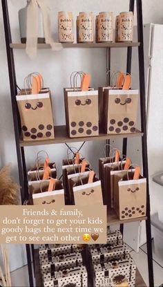 there is a shelf with bags on it that says friends & family don't forget to get your kids goody bags the next time