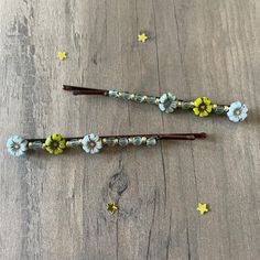 Beaded bobby pins are the perfect hair accessory! Light blue and yellow flower beads complemented with smaller gold and blue beads. Secured with nylon thread to a brown bobby pin. These larger bobby pins make a unique gift or bridal accessory. Made with love for superior durability for everyday wear.  2 3/4 inches long. Gemstone Hairpins: https://www.etsy.com/shop/BriteComet?ref=seller-platform-mcnav§ion_id=24822473 Pearl Hairpins: https://www.etsy.com/shop/BriteComet?ref=seller-platform-mcnav§ion_id=24851366 Everything: https://www.etsy.com/shop/BriteComet Beaded Bobby Pins, Bobby Pin Hairstyles, Bridal Accessory, Pearl Hair Pins, Hair Accessories Gift, Gold And Blue, Bobby Pin, Flower Beads, Yellow Flower