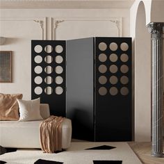 a room divider in the middle of a living room with black and white decor