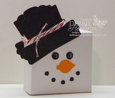 a white box with a snowman wearing a black hat