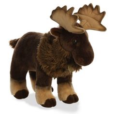 a stuffed moose is standing with its head turned to the side