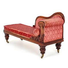 an antique style chaise lounge with red upholstered fabric on the back and arms