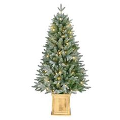 Bring the magic of the holidays to any room in your home with our stunning 4.5 ft. Potted Tree with Warm White Lights from Red Shed! Adorned with 736 frosted tips and 100 warm white LED lights, this artificial tree will fill your space with a cozy, inviting glow. The tree sits in a wooden box planter and is perfect for entryways, living rooms or bedrooms. Tree sits in a wooden box planter 736 beautifully frosted tips 100 warm white LED lights Measures approximately 30" in diameter Wooden Planter Boxes, Potted Trees, Artificial Tree, White Led Lights, Artificial Christmas Tree, Warm White, White Light, Entryway, Shed