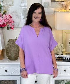 Introducing our "On Cloud Nine Top" in Lavender, a dreamy and stylish addition to your wardrobe that's perfect for adding a touch of elegance to any outfit. This woven bubble airflow split neck top offers a chic and sophisticated look with a relaxed fit that's both comfortable and flattering.
Crafted with care, this top features a split neck design that adds a modern twist to the classic silhouette. The soft lavender color evokes a sense of tranquility and serenity, making it perfect for both casual and dressy occasions.
Available in sizes S to L, this top is designed to fit a variety of body types, ensuring a comfortable and flattering fit for everyone. Whether you're heading to the office, meeting friends for brunch, or enjoying a night out on the town, this top is sure to become a stapl Lavender V-neck Blouse For Spring, Spring Lavender V-neck Blouse, Versatile V-neck Top For Spring, Feminine Lavender V-neck Blouse, Elegant Lavender V-neck Blouse, Spring Lavender V-neck Top, Chic Flowy Blouse With Split Neck, Flowy Purple V-neck Blouse, Chic Flowy Split Neck Blouse