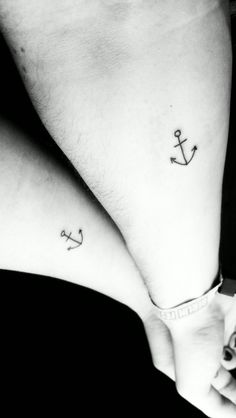 two people with matching tattoos on their legs