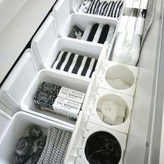 an organized drawer is shown with black and white items