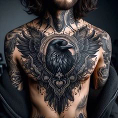 a man with tattoos on his chest is wearing a crow and crossbones tattoo