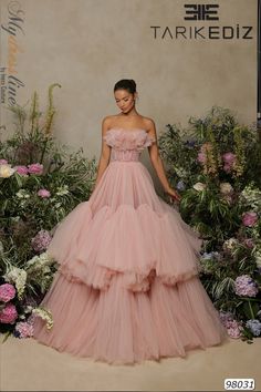 Looking for an elegant and eye-catching dress for your next special event? Check out the Tarik Ediz 98031 from the Spring 2022 evening collection. This gorgeous tulle dress comes in a variety of colors to suit any style, and it's sure to make you stand out from the crowd. Whether you're attending a wedding, formal dinner, or another special occasion, this is the perfect dress to ensure that you look and feel your best. Order yours today and be ready for any event on your calendar! Haute Couture, Pink Evening Gowns, Funky Dresses, Pink Gown, Belle Silhouette, Tarik Ediz, Princess Skirt, Full Length Gowns, Cocktail Gowns