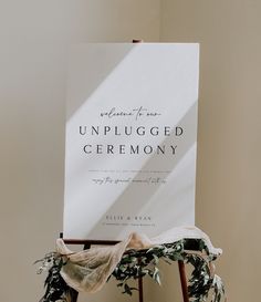 an unplugged ceremony sign sitting on top of a chair