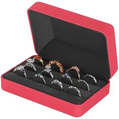 six pairs of rings in a red box