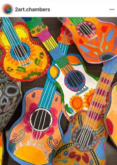 an image of colorful guitars made out of paper