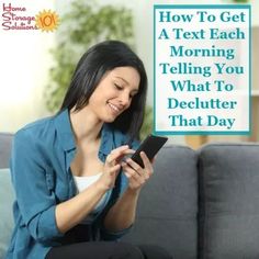 a woman sitting on a couch looking at her cell phone with the text how to get a text each morning telling you what to declutter that day