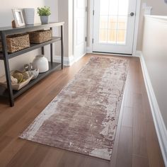 a large rug is on the floor in front of a white door and entryway