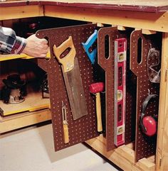 a man is working with tools in his workbench, and the caption reads expert diyverss a peg share