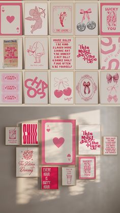 pink and white greeting cards are hanging on the wall