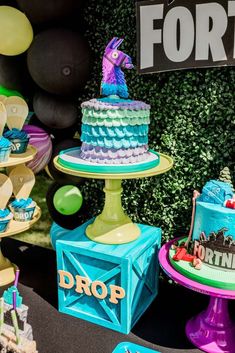 there are many different cakes on display at this party, including one for the fortnima