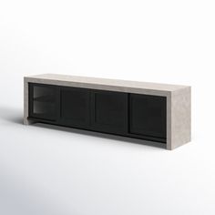 a white and black cabinet with doors on each side, in front of a gray background