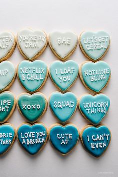 heart shaped cookies with words written on them