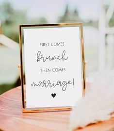 a sign that says first comes branch then comes marriage on top of a wooden table