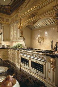 an ornate kitchen with gold accents and marble counter tops