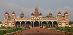 an ornate building with red and white domes