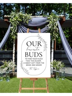 a sign that says our favorite buds to find your place and take the bloom from those bride and groom