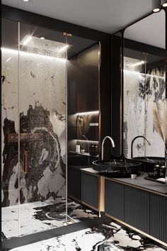 a black and white bathroom with gold accents