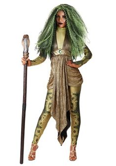 a woman with green hair and makeup holding a stick