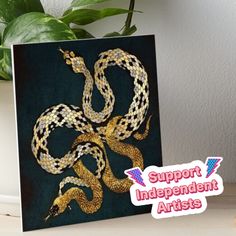 a card with an image of a snake on it and the words support independent artists