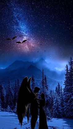 two children looking up at the stars in the night sky with mountains and trees behind them