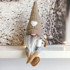 PRICES MAY VARY. Adorable Coffee Gnome Dolls - These cute coffee gnome dolls will please you with their kindness and charm. They want a place on your table, desk, fireplace, bookshelf, tiered tray, and more, creating a festive and welcoming home environment. Handmade and High-Quality Material - These handmade gnome figures are made of plush fabric and felt, soft, non-toxic, and neatly sewn. The coffee cups in their hands are made of felt cloth. The perfect gift - Scandinavian gnomes bring joy an Coffee Gnome, Swedish Tomte, Traditional Christmas Decorations, Doll Home, New Years Decorations, Coffee Lover Gifts, Christmas Gnome, Tiered Tray Decor, Cute Dolls