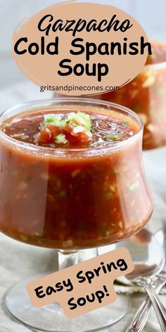 two glasses filled with soup sitting on top of a table