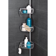 three tier shower caddy with soap, shampoo and lotion in the corner