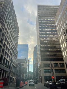 a city street with tall buildings on both sides