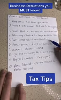 a person writing on a piece of paper with the words tax tips written below it