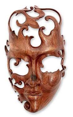 a wooden mask with intricate designs on it