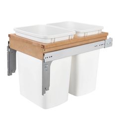 two white bins with wooden handles are attached to the back of a wall mounted trash can